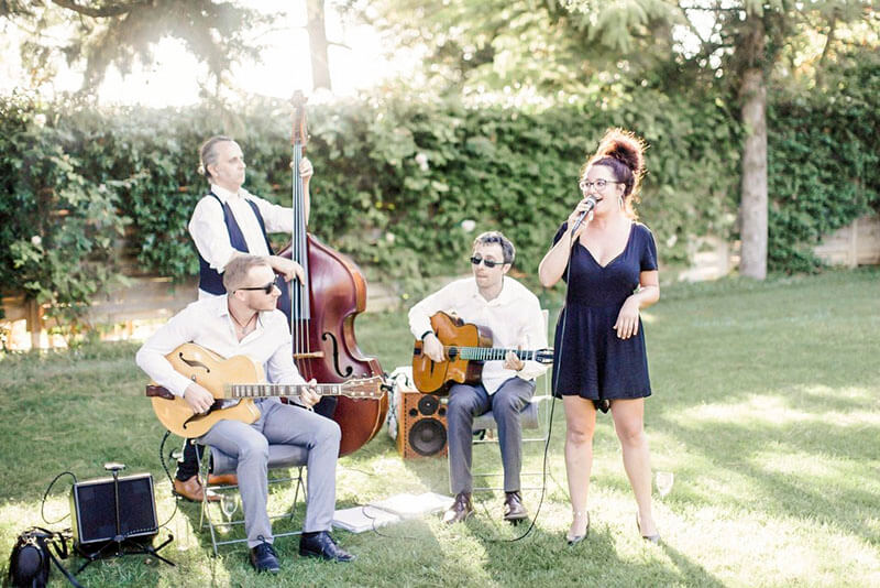 Cordes Nomades quartet with vocalist Lucy Bely performing at an outdoor wedding reception