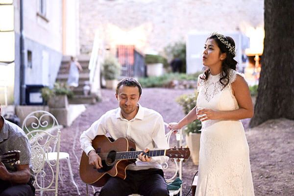 Cordes Nomades vocalist and gypsy jazz musicians performing at a wedding in Provence